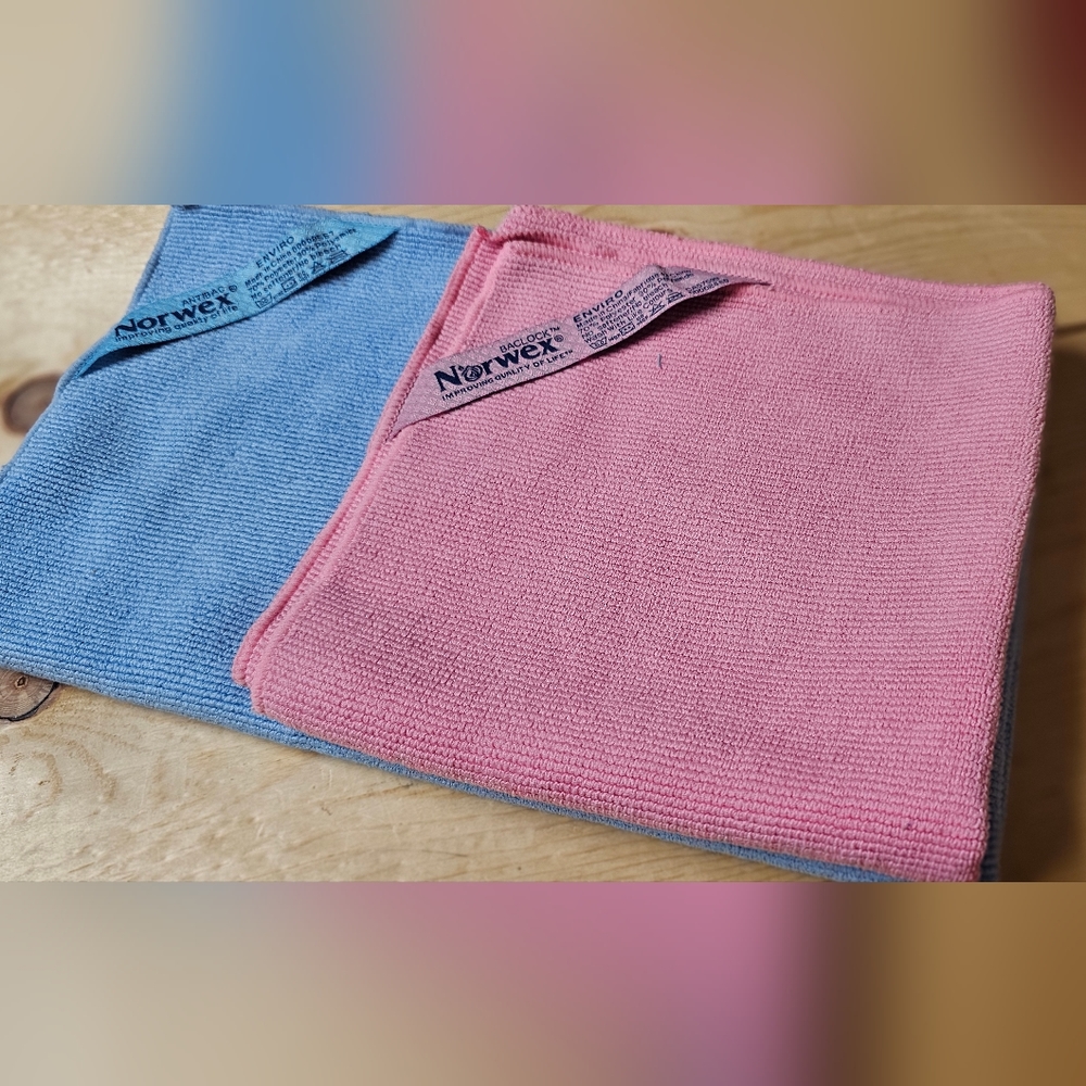 2 Norwex Enviro Clothes -one pink regular size- -one blue XL-